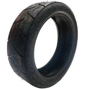 Black tire with tread pattern on a white background