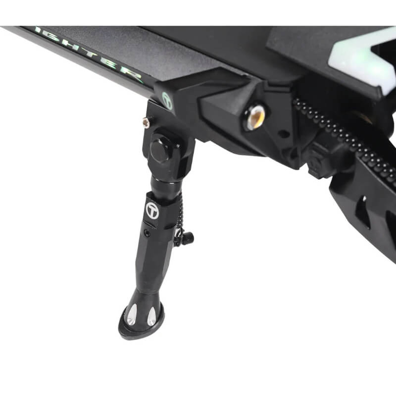 Close-up of a black motorcycle foot peg on a white background