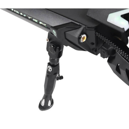 Close-up of a black motorcycle foot peg on a white background