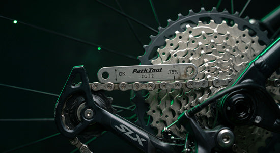 Close-up of an e-bike drivetrain being adjusted on a workshop stand