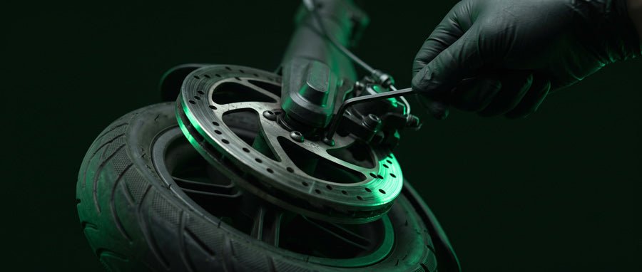Brake caliper and disc rotor service on an electric scooter